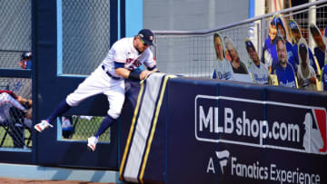 Oct 8, 2020; Los Angeles, California, USA; Houston Astros right fielder Josh Reddick (22) makes a home run robbing catch against the wall on a ball hit by Oakland Athletics first baseman Matt Olson (28) during the fourth inning during game four of the 2020 ALDS at Dodger Stadium. Mandatory Credit: Jayne Kamin-Oncea-USA TODAY Sports