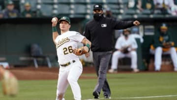 May 7, 2021; Oakland, California, USA; Oakland Athletics third baseman Matt Chapman (26) throws the ball to first base to record an out during the fourth inning against the Tampa Bay Rays at RingCentral Coliseum. Mandatory Credit: Darren Yamashita-USA TODAY Sports