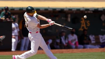 May 9, 2021; Oakland, California, USA; Oakland Athletics right fielder Stephen Piscotty (25) hits a single during the fourth inning against the Tampa Bay Rays at RingCentral Coliseum. Mandatory Credit: Darren Yamashita-USA TODAY Sports