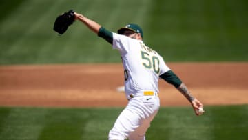 May 6, 2021; Oakland, California, USA; Oakland Athletics starting pitcher Mike Fiers (50) delivers a pitch against the Toronto Blue Jays during the third inning at RingCentral Coliseum. Mandatory Credit: D. Ross Cameron-USA TODAY Sports