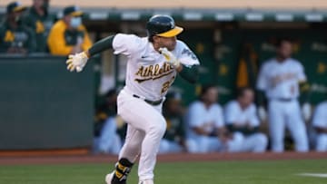 May 24, 2021; Oakland, California, USA; Oakland Athletics center fielder Ramon Laureano (22) runs after hitting a single during the first inning against the Seattle Mariners at RingCentral Coliseum. Mandatory Credit: Stan Szeto-USA TODAY Sports