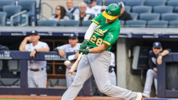 Jun 18, 2021; Bronx, New York, USA; Oakland Athletics first baseman Matt Olson (28) hits a home run during the first inning against the New York Yankees at Yankee Stadium. Mandatory Credit: Vincent Carchietta-USA TODAY Sports