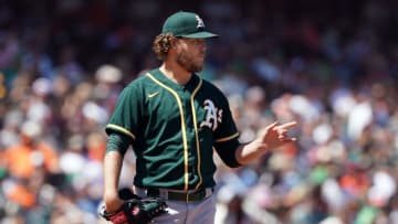 Jun 27, 2021; San Francisco, California, USA; Oakland Athletics starting pitcher Cole Irvin (19) gestures on the mound during the eighth inning against the San Francisco Giants at Oracle Park. Mandatory Credit: Darren Yamashita-USA TODAY Sports