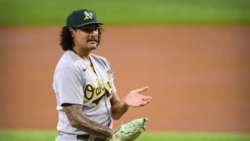 Aug 15, 2021; Arlington, Texas, USA; Oakland Athletics starting pitcher Sean Manaea (55) argues a pitch call as he pitches against the Texas Rangers during the first inning at Globe Life Field. Mandatory Credit: Jerome Miron-USA TODAY Sports