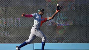 Jul 16, 2022; Los Angeles, CA, USA; American League Futures right fielder Denzel Clarke (5) makes a catch at the wall on a ball hit by National League Futures catcher Diego Cartaya (not pictured) in the seventh inning of the All Star-Futures Game at Dodger Stadium. Mandatory Credit: Jayne Kamin-Oncea-USA TODAY Sports