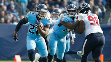 NASHVILLE, TENNESSEE - DECEMBER 15: Running back Derrick Henry #22 of the Tennessee Titans rushes against the Houston Texans during the first half at Nissan Stadium on December 15, 2019 in Nashville, Tennessee. (Photo by Frederick Breedon/Getty Images)