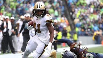 SEATTLE, WASHINGTON - SEPTEMBER 22: Alvin Kamara #41 of the New Orleans Saints runs with the ball against Shaquill Griffin #26 of the Seattle Seahawks in the third quarter during their game at CenturyLink Field on September 22, 2019 in Seattle, Washington. (Photo by Abbie Parr/Getty Images)