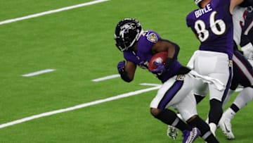 HOUSTON, TEXAS - SEPTEMBER 20: Mark Ingram #21 of the Baltimore Ravens runs for a touchdown against the Houston Texans during the second half at NRG Stadium on September 20, 2020 in Houston, Texas. (Photo by Bob Levey/Getty Images)