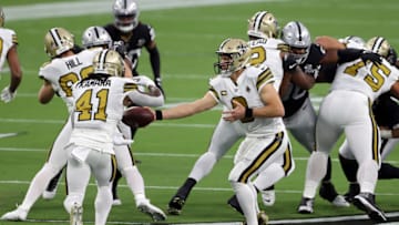 LAS VEGAS, NEVADA - SEPTEMBER 21: Drew Brees #9 of the New Orleans Saints hands the ball off to Alvin Kamara #41 in the first quarter against the Las Vegas Raiders at Allegiant Stadium on September 21, 2020 in Las Vegas, Nevada. (Photo by Christian Petersen/Getty Images)