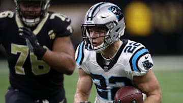 NEW ORLEANS, LOUISIANA - DECEMBER 30: Christian McCaffrey #22 of the Carolina Panthers runs with the ball as Taylor Stallworth #76 of the New Orleans Saints defends during the first half at the Mercedes-Benz Superdome on December 30, 2018 in New Orleans, Louisiana. (Photo by Chris Graythen/Getty Images)
