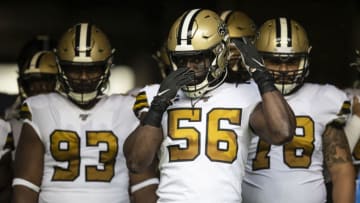 SEATTLE, WA - SEPTEMBER 22: Linebacker Demario Davis #56 of the New Orleans Saints, defensive lineman David Onyemata #93 and offensive lineman Erik McCoy #78 prepare to take the field before a game against the Seattle Seahawks at CenturyLink Field on September 22, 2019 in Seattle, Washington. The Saints won 33-27. (Photo by Stephen Brashear/Getty Images)