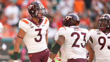 MIAMI, FLORIDA - OCTOBER 05: Caleb Farley #3 of the Virginia Tech Hokies celebrates with teammates against the Miami Hurricanes during the first half at Hard Rock Stadium on October 05, 2019 in Miami, Florida. (Photo by Michael Reaves/Getty Images)