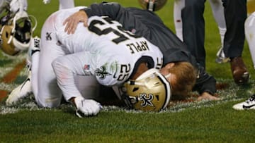 CHICAGO, ILLINOIS - OCTOBER 20: Eli Apple #25 of the New Orleans Saints puts his head down after he was injured on a play during the second half against the Chicago Bears at Soldier Field on October 20, 2019 in Chicago, Illinois. (Photo by Nuccio DiNuzzo/Getty Images)