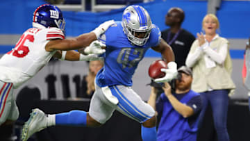DETROIT, MICHIGAN - OCTOBER 27: Devon Kennard #42 of the Detroit Lions runs past Saquon Barkley #26 of the New York Giants for a first half touchdown after picking up a fumble at Ford Field on October 27, 2019 in Detroit, Michigan. (Photo by Gregory Shamus/Getty Images)