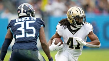 NASHVILLE, TN - DECEMBER 22: Alvin Kamara #41 of the New Orleans Saints runs the ball in the first half and tries to avoid the tackle of Tramaine Brock Sr. #35 of the Tennessee Titans at Nissan Stadium on December 22, 2019 in Nashville, Tennessee. (Photo by Wesley Hitt/Getty Images)