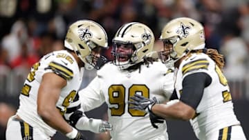 ATLANTA, GEORGIA - NOVEMBER 28: Ra'Shede Hageman #90 and Cameron Jordan #94 of the New Orleans Saints celebrate a sack by Marcus Davenport #92 against the Atlanta Falcons during the first quarter at Mercedes-Benz Stadium on November 28, 2019 in Atlanta, Georgia. (Photo by Todd Kirkland/Getty Images)