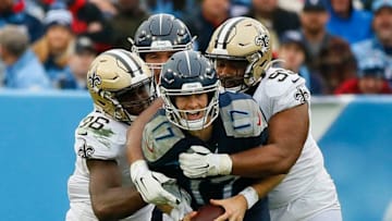 NASHVILLE, TENNESSEE - DECEMBER 22: Quarterback Ryan Tannehill #17 of the Tennessee Titans is sacked by the New Orleans Saints defense during the third quarter in the game at Nissan Stadium on December 22, 2019 in Nashville, Tennessee. (Photo by Frederick Breedon/Getty Images)