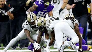 NEW ORLEANS, LOUISIANA - JANUARY 05: Janoris Jenkins #20 of the New Orleans Saints forces a fumble on Adam Thielen #19 of the Minnesota Vikings in the NFC Wild Card Playoff game at Mercedes Benz Superdome on January 05, 2020 in New Orleans, Louisiana. (Photo by Jonathan Bachman/Getty Images)