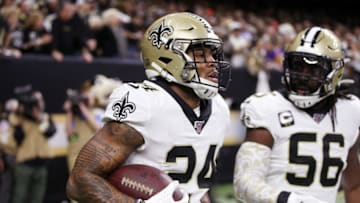 NEW ORLEANS, LOUISIANA - JANUARY 05: Vonn Bell #24 of the New Orleans Saints celebrates with Demario Davis #56 after recovering a fumble by Adam Thielen #19 of the Minnesota Vikings (not pictured) during the first quarter in the NFC Wild Card Playoff game at Mercedes Benz Superdome on January 05, 2020 in New Orleans, Louisiana. (Photo by Chris Graythen/Getty Images)
