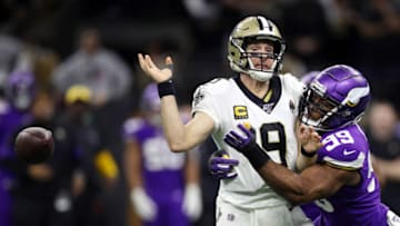 NEW ORLEANS, LOUISIANA - JANUARY 05: Drew Brees #9 of the New Orleans Saints fumbles the ball as he is sacked by Danielle Hunter #99 of the Minnesota Vikings during the fourth quarter in the NFC Wild Card Playoff game at Mercedes Benz Superdome on January 05, 2020 in New Orleans, Louisiana. (Photo by Chris Graythen/Getty Images)
