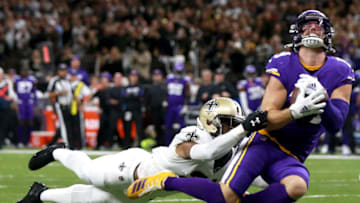 NEW ORLEANS, LOUISIANA - JANUARY 05: Adam Thielen #19 of the Minnesota Vikings catches a pass over Patrick Robinson #21 of the New Orleans Saints during the NFC Wild Card Playoff game at Mercedes Benz Superdome on January 05, 2020 in New Orleans, Louisiana. (Photo by Sean Gardner/Getty Images)