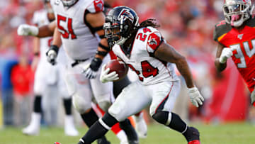 TAMPA, FLORIDA - DECEMBER 29: Devonta Freeman #24 of the Atlanta Falcons runs with the ball against the Tampa Bay Buccaneers during the first half at Raymond James Stadium on December 29, 2019 in Tampa, Florida. (Photo by Michael Reaves/Getty Images)