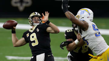 NEW ORLEANS, LOUISIANA - OCTOBER 12: Drew Brees #9 of the New Orleans Saints throws a 41-yard touchdown to Jared Cook #87 against the Los Angeles Chargers during their NFL game at Mercedes-Benz Superdome on October 12, 2020 in New Orleans, Louisiana. (Photo by Chris Graythen/Getty Images)