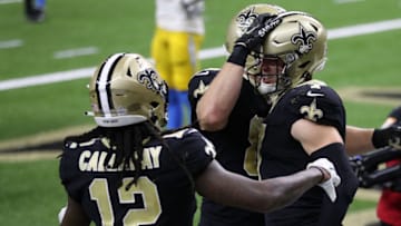 NEW ORLEANS, LOUISIANA - OCTOBER 12: Taysom Hill #7 of the New Orleans Saints celebrates his nine-yard touchdown against the Los Angeles Chargers with Marquez Callaway #12 during their NFL game at Mercedes-Benz Superdome on October 12, 2020 in New Orleans, Louisiana. (Photo by Chris Graythen/Getty Images)
