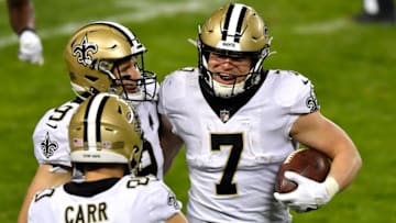 CHICAGO, ILLINOIS - NOVEMBER 01: Taysom Hill #7 of the New Orleans Saints celebrates a touchdown with Drew Brees #9 and Austin Carr #80 of the New Orleans Saints in the fourth quarter against the Chicago Bears at Soldier Field on November 01, 2020 in Chicago, Illinois. (Photo by Quinn Harris/Getty Images)