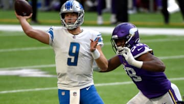 MINNEAPOLIS, MINNESOTA - NOVEMBER 08: Matthew Stafford #9 of the Detroit Lions is pressured by D.J. Wonnum #98 of the Minnesota Vikings at U.S. Bank Stadium on November 08, 2020 in Minneapolis, Minnesota. (Photo by Stephen Maturen/Getty Images)