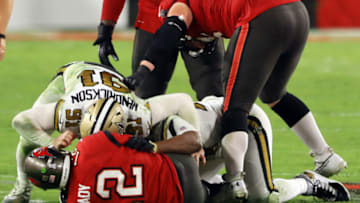 Trey Hendrickson #91 and Cameron Jordan #94 of the New Orleans Saints sack Tom Brady #12 of the Tampa Bay Buccaneers (Photo by Mike Ehrmann/Getty Images)