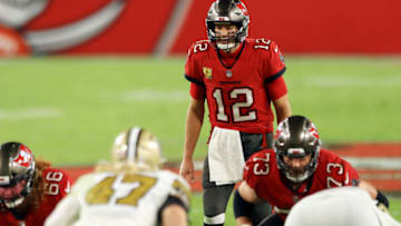 TAMPA, FLORIDA - NOVEMBER 08: Tom Brady #12 of the Tampa Bay Buccaneers prepares to take a snap during the second half against the New Orleans Saints at Raymond James Stadium on November 08, 2020 in Tampa, Florida. (Photo by Mike Ehrmann/Getty Images)