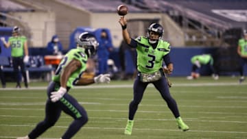 SEATTLE, WASHINGTON - NOVEMBER 19: Russell Wilson #3 passes to David Moore #83 of the Seattle Seahawks in the fourth quarter against the Arizona Cardinals at Lumen Field on November 19, 2020 in Seattle, Washington. (Photo by Abbie Parr/Getty Images)
