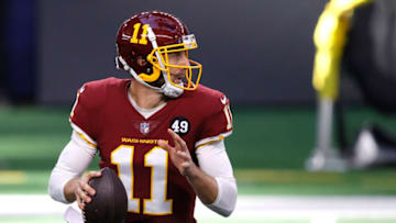 ARLINGTON, TEXAS - NOVEMBER 26: Alex Smith #11 of the Washington Football Team looks to pass during the first quarter of a game against the Dallas Cowboys at AT&T Stadium on November 26, 2020 in Arlington, Texas. (Photo by Tom Pennington/Getty Images)