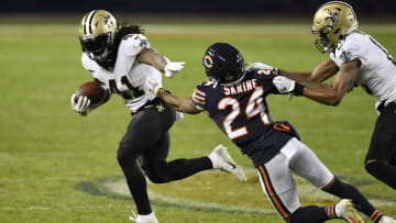 CHICAGO, ILLINOIS - NOVEMBER 01: Alvin Kamara #41 of the New Orleans Saints runs against Buster Skrine #24 of the Chicago Bears at Soldier Field on November 01, 2020 in Chicago, Illinois. (Photo by Quinn Harris/Getty Images)