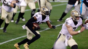 CHARLOTTE, NORTH CAROLINA - JANUARY 03: Wide receiver Emmanuel Sanders #17 of the New Orleans Saints carries the ball for yardage during the second quarter of their game against the Carolina Panthers at Bank of America Stadium on January 03, 2021 in Charlotte, North Carolina. (Photo by Jared C. Tilton/Getty Images)