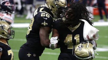 NEW ORLEANS, LOUISIANA - JANUARY 10: Latavius Murray #28 of the New Orleans Saints celebrates with Alvin Kamara #41 after scoring a six yard touchdown against the Chicago Bears during the third quarter in the NFC Wild Card Playoff game at Mercedes Benz Superdome on January 10, 2021 in New Orleans, Louisiana. (Photo by Chris Graythen/Getty Images)