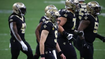 NEW ORLEANS, LOUISIANA - JANUARY 17: Drew Brees #9 of the New Orleans Saints walks off the field against the Tampa Bay Buccaneers during the fourth quarter in the NFC Divisional Playoff game at Mercedes Benz Superdome on January 17, 2021 in New Orleans, Louisiana. (Photo by Chris Graythen/Getty Images)