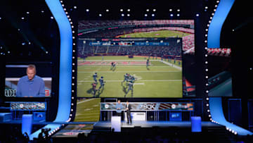 LOS ANGELES, CA - JUNE 04: NFL Hall of Fame quarterback Joe Montana (L) plays the new EA Sports Madden 13 game as EA Sports as Executive Vice President, EA Sports Andrew Wilson looks after announcing all-new Kinect voice functionality for the new EA Sports games during the Microsoft Xbox press conference at the Electronic Entertainment Expo at the Galen Center on June 4, 2012 in Los Angeles, California. Thousands are expected to attend the annual three-day convention to see the latest games and announcements from the gaming industry. (Photo by Kevork Djansezian/Getty Images)