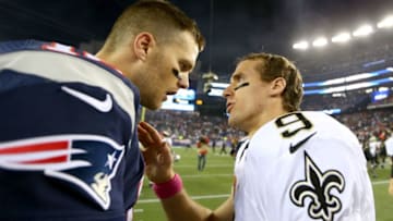 FOXBORO, MA - OCTOBER 13: Tom Brady #12 of the New England Patriots and Drew Brees #9 of the New Orleans Saints talk after the game at Gillette Stadium on October 13, 2013 in Foxboro, Massachusetts.The New England Patriots defeated the New Orleans Saints 30-27. (Photo by Elsa/Getty Images)