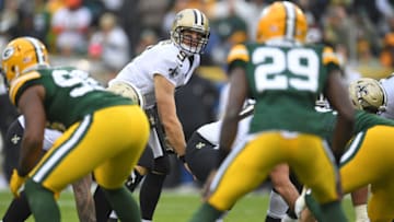 GREEN BAY, WI - OCTOBER 22: Drew Brees #9 of the New Orleans Saints anticipates a snap during a game against the Green Bay Packers at Lambeau Field on October 22, 2017 in Green Bay, Wisconsin. The Saints defeated the Packers 26-17. (Photo by Stacy Revere/Getty Images)