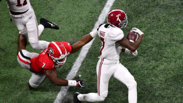 ATLANTA, GA - JANUARY 08: Trevon Diggs #7 of the Alabama Crimson Tide breaks the tackle of Lorenzo Carter #7 of the Georgia Bulldogs in the CFP National Championship presented by AT&T at Mercedes-Benz Stadium on January 8, 2018 in Atlanta, Georgia. (Photo by Scott Cunningham/Getty Images)