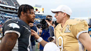 ORLANDO, FL - JANUARY 27: Quarterback Lamar Jackson #8 of the Baltimore Ravens from the AFC Team talk with Quarterback Drew Brees #9 of the New Orleans Saints from the NFC Team after the NFL Pro Bowl Game at Camping World Stadium on January 26, 2020 in Orlando, Florida. The AFC defeated the NFC 38 to 33. (Photo by Don Juan Moore/Getty Images)
