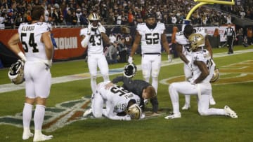 CHICAGO, ILLINOIS - OCTOBER 20: Eli Apple #25 of the New Orleans Saints gets injured late in the fourth quarter against the Chicago Bears at Soldier Field on October 20, 2019 in Chicago, Illinois. (Photo by Nuccio DiNuzzo/Getty Images)