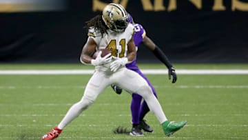 Dec 25, 2020; New Orleans, Louisiana, USA; New Orleans Saints running back Alvin Kamara (41) is defended by Minnesota Vikings cornerback Jeff Gladney (20) in the second half at the Mercedes-Benz Superdome. Mandatory Credit: Chuck Cook-USA TODAY Sports