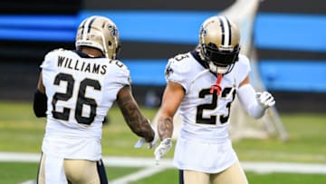 Jan 3, 2021; Charlotte, North Carolina, USA; New Orleans Saints cornerback P.J. Williams (26) with cornerback Marshon Lattimore (23) before the game at Bank of America Stadium. Mandatory Credit: Bob Donnan-USA TODAY Sports