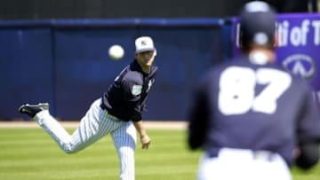 Feb 19, 2016; Tampa, FL, USA; New York Yankees pitcher James Kaprielian (90) and pitcher Brady Lail (87) work out at George M. Steinbrenner Field. Mandatory Credit: Kim Klement-USA TODAY Sports