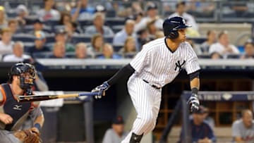 Jun 19, 2015; Bronx, NY, USA; New York Yankees center fielder Mason Williams (63) hits a single against the Detroit Tigers during the fifth inning at Yankee Stadium. Mandatory Credit: Brad Penner-USA TODAY Sports
