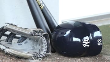 Mar 2, 2015; Tampa, FL, USA; New York Yankees center fielder Jake Cave (93) hat glove and ball rests near the clubhouse during spring training workouts at George M. Steinbrenner Field. Mandatory Credit: Reinhold Matay-USA TODAY Sports