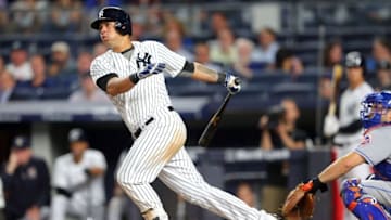 Aug 4, 2016; Bronx, NY, USA; New York Yankees designated hitter Gary Sanchez (24) hits a single against the New York Mets during the ninth inning at Yankee Stadium. Mandatory Credit: Brad Penner-USA TODAY Sports